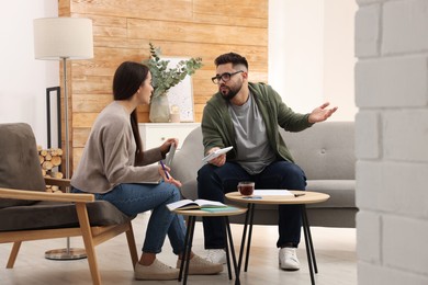 Young couple discussing family budget at home