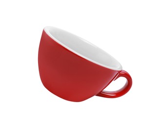 Photo of One red ceramic cup isolated on white