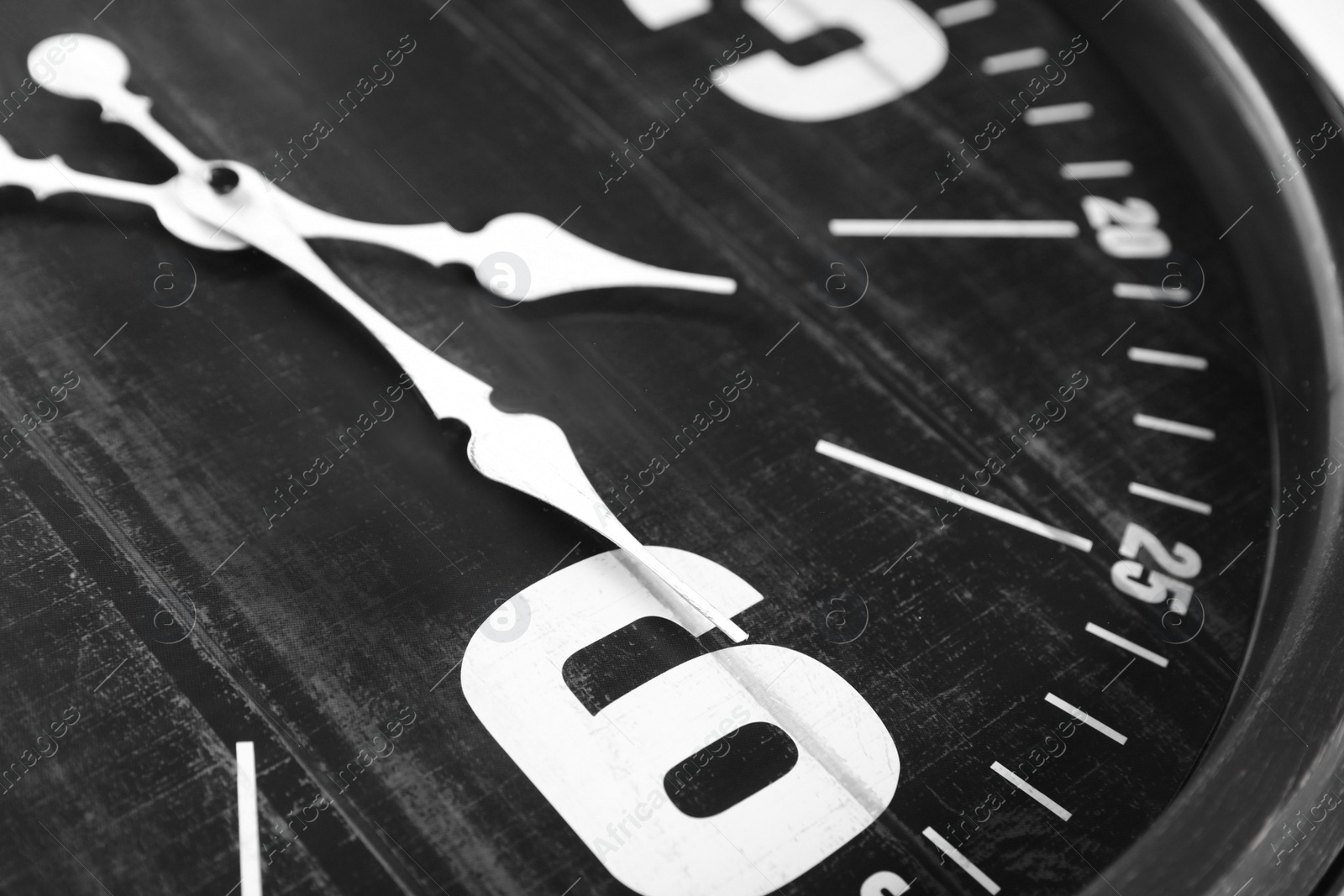 Photo of Closeup view of black stylish analog clock