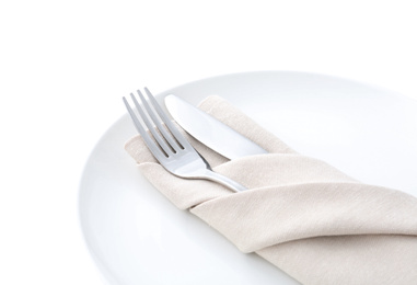 Photo of Stylish elegant cutlery with napkin in plate isolated on white