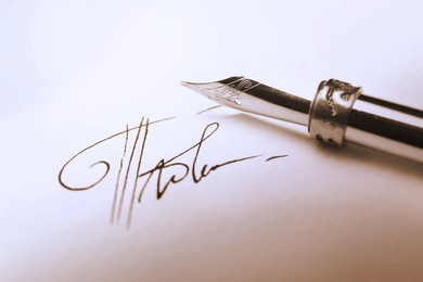 Image of Sheet of paper with fountain pen and signature, closeup