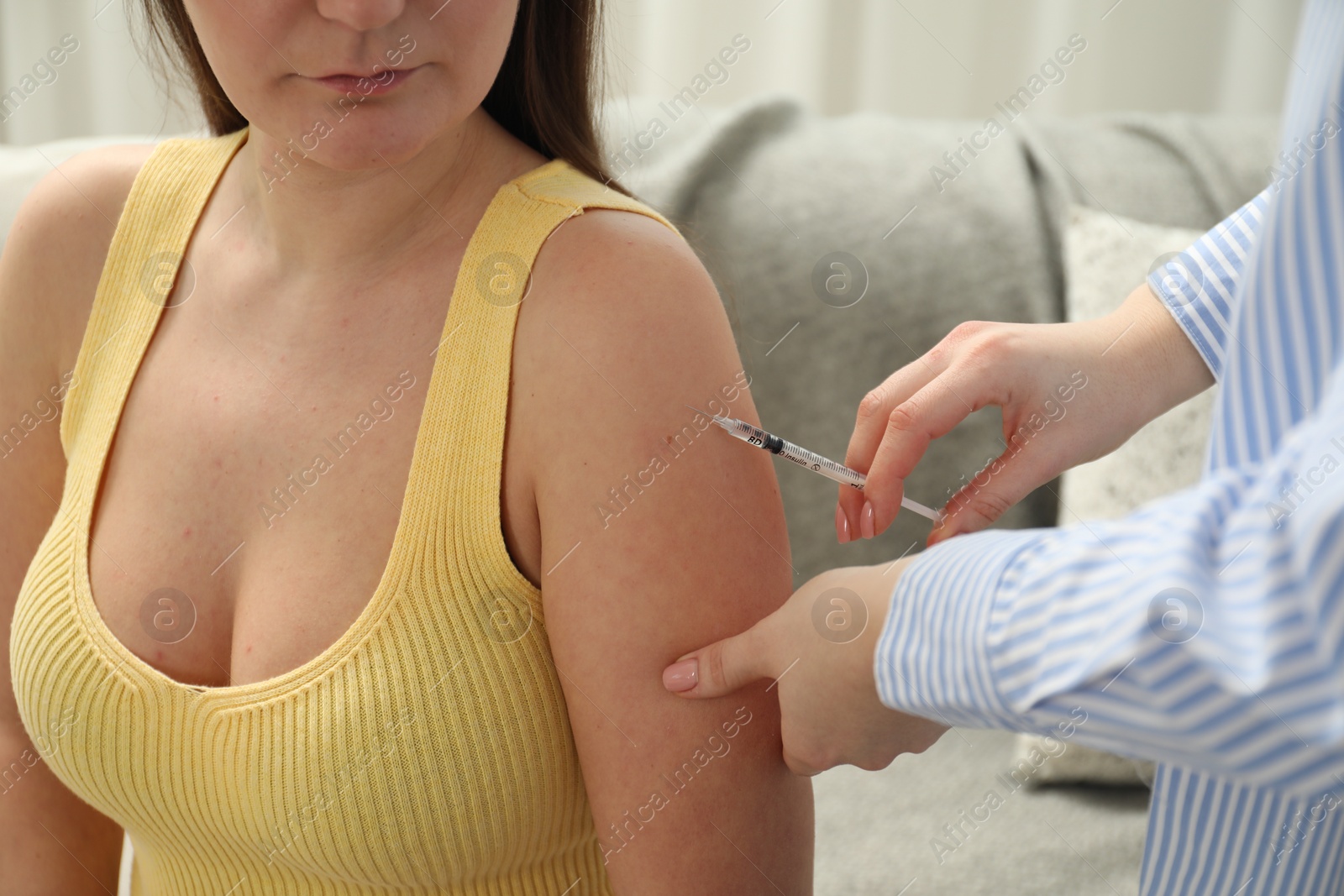 Photo of Diabetes. Woman getting insulin injection indoors, closeup