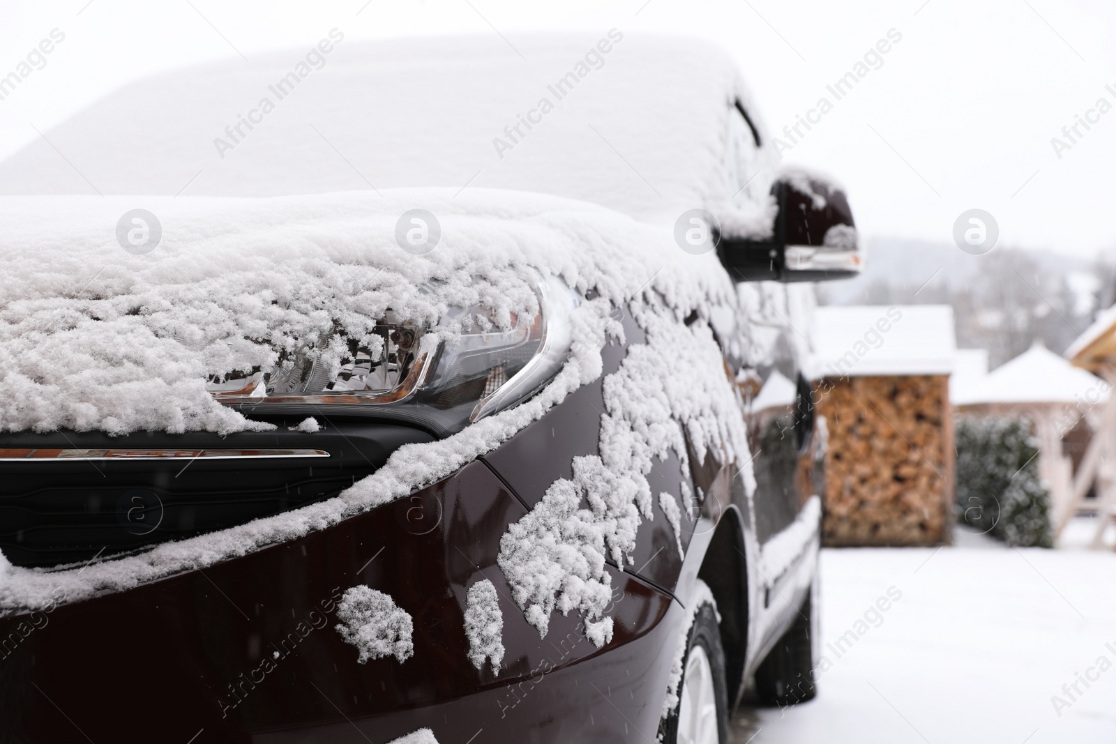 Photo of Car covered with snow after storm outdoors on beautiful winter day, closeup