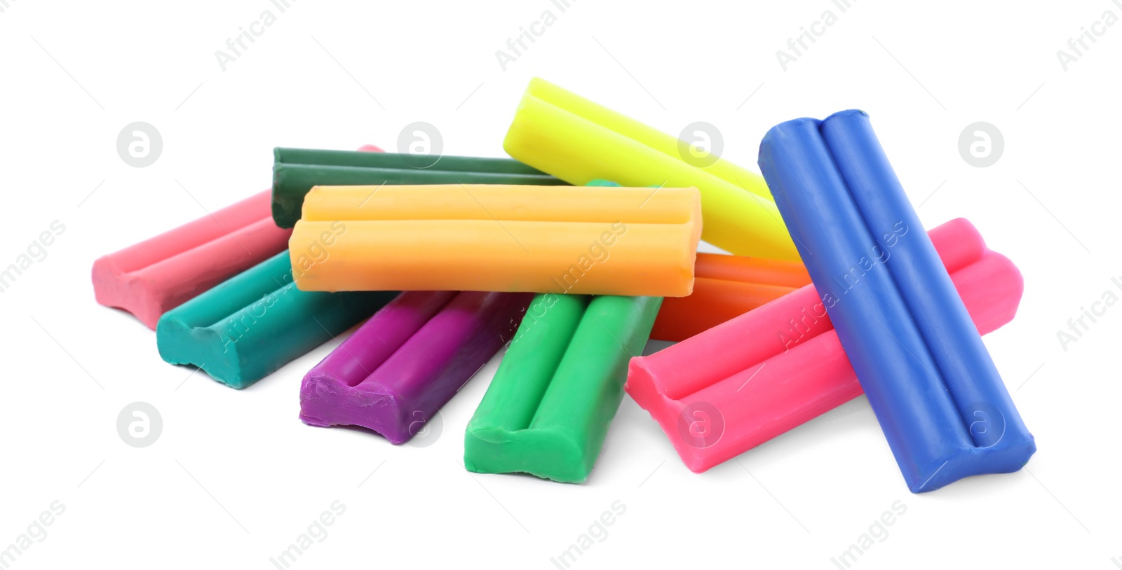 Photo of Many different colorful plasticine pieces on white background