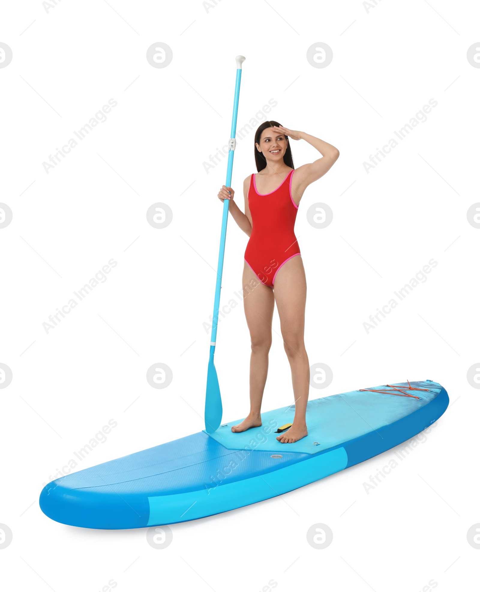 Photo of Happy woman with paddle on blue SUP board against white background