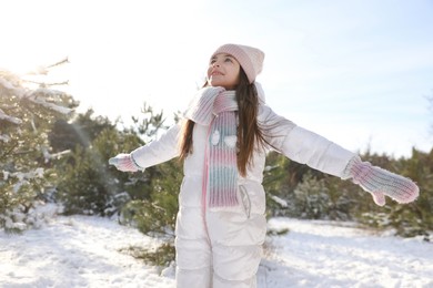 Cute little girl outdoors on winter day. Christmas vacation