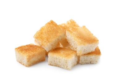 Photo of Pile of delicious crispy croutons on white background