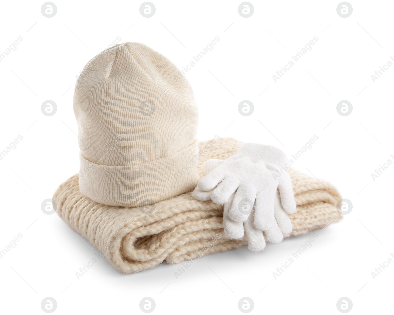 Photo of Woolen gloves, scarf and hat on white background