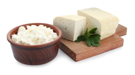 Photo of Different types of delicious tofu cheese with parsley on white background