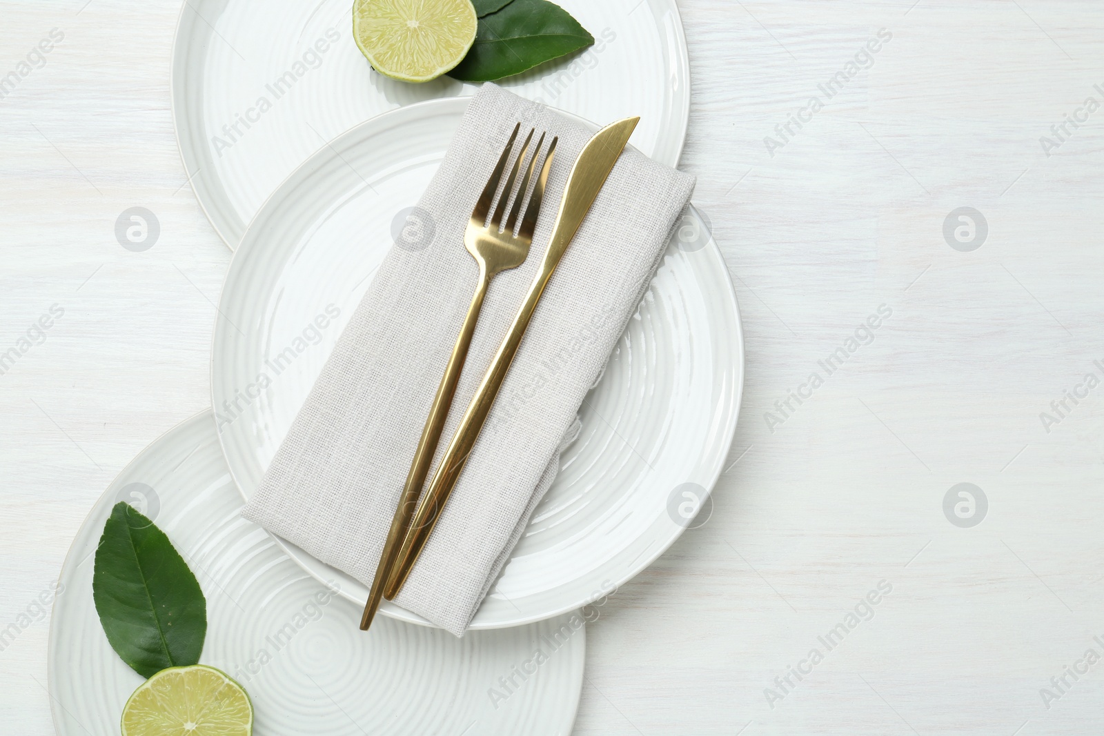 Photo of Composition with stylish ceramic plates on white wooden table, top view. Space for text