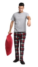 Photo of Somnambulist with red pillow on white background. Sleepwalking