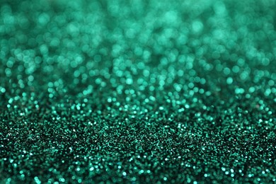 Photo of Shiny green glitter as background. Bokeh effect