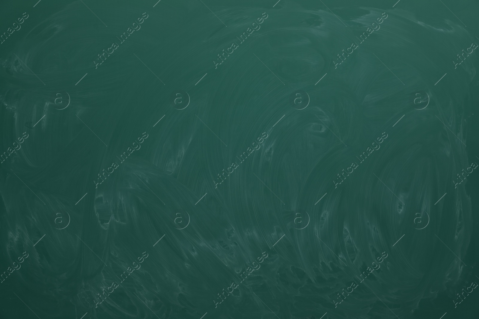 Photo of Dirty green chalkboard as background. School equipment