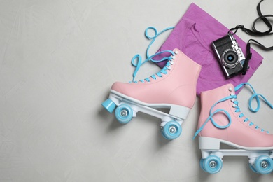 Flat lay composition with quad roller skates and space for text on light background