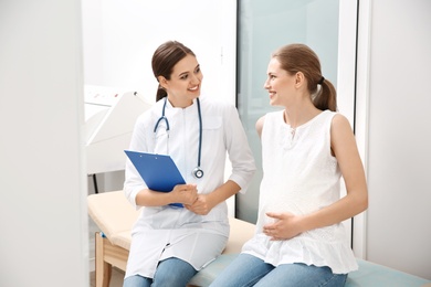 Pregnant woman having appointment at gynecologist office