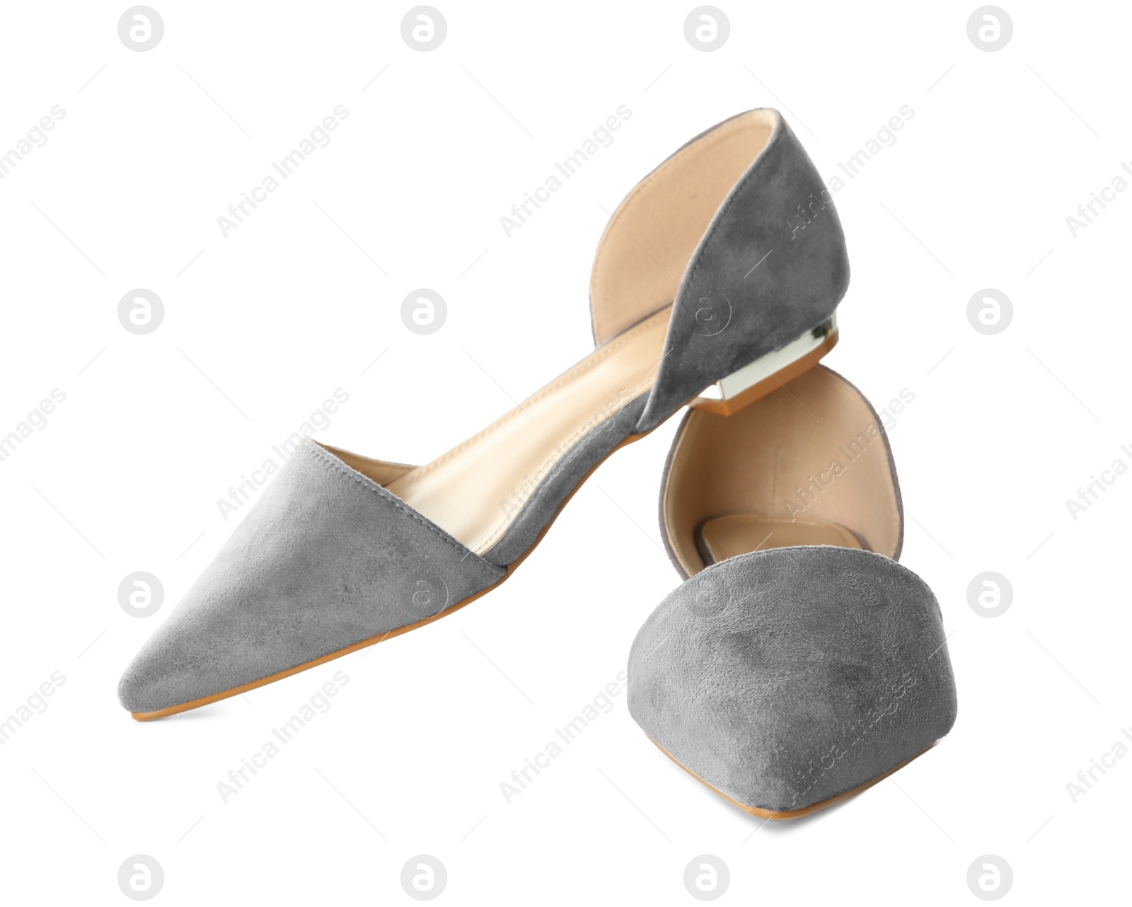 Photo of Pair of female shoes on white background