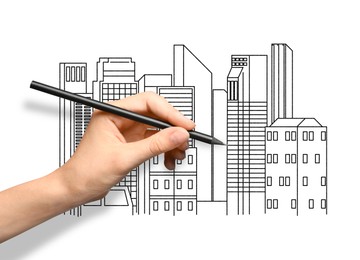 Image of Woman drawing sketch of cityscape with graphite pencil on white paper, closeup