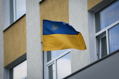 Photo of National flag of Ukraine on building facade