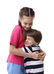Happy brother and sister hugging on white background
