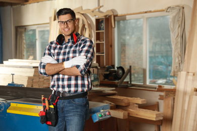 Photo of Professional carpenter with set of tools in workshop