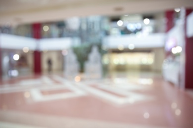 Photo of Blurred view of shopping mall entrance hall interior