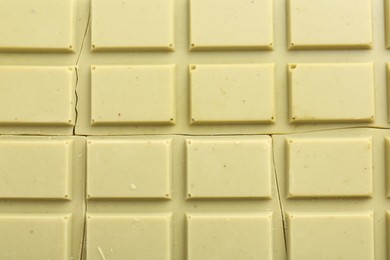 Photo of Broken tasty matcha chocolate bar as background, top view