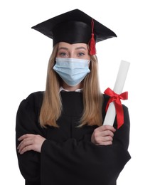 Photo of Student in protective mask with diploma on white background