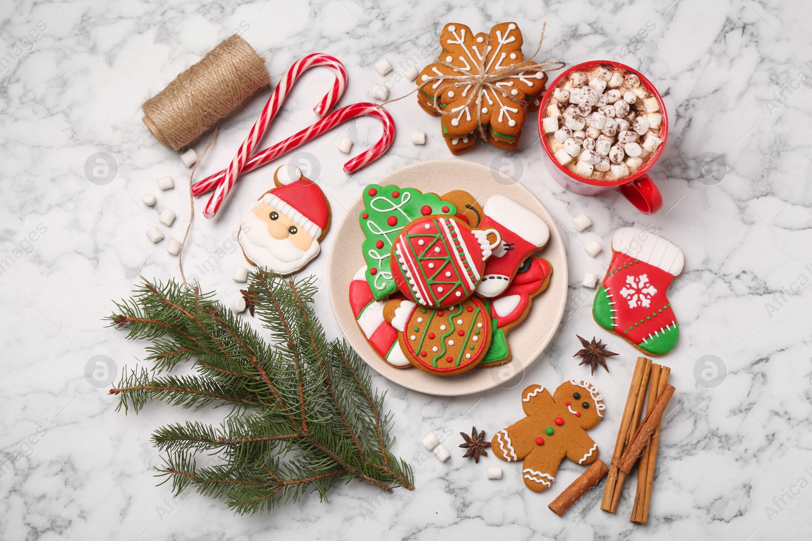 Photo of Flat lay composition with decorated Christmas cookies on white marble table