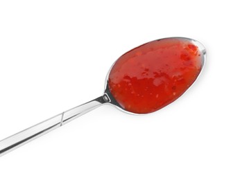 Photo of Spicy chili sauce in spoon isolated on white, top view