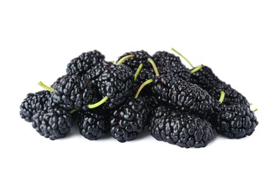 Pile of ripe black mulberries on white background