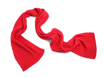 One red knitted scarf on white background, top view