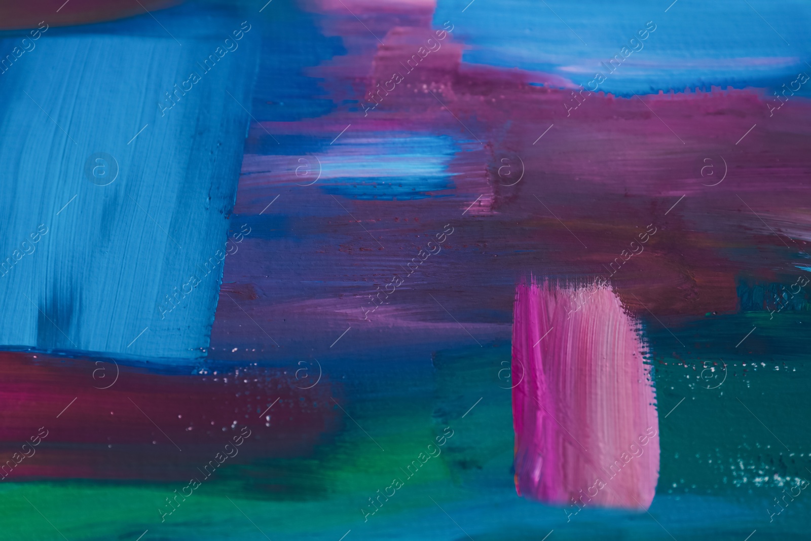 Photo of Canvas with colorful abstract painting, closeup view