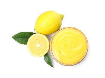 Delicious lemon curd, fresh fruits and green leaves on white background, top view