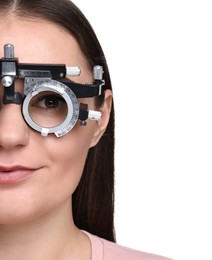 Vision testing. Young woman with trial frame on white background