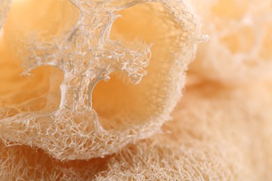 Natural loofah sponge as background, closeup view