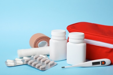 Photo of First aid kit on color background. Health care