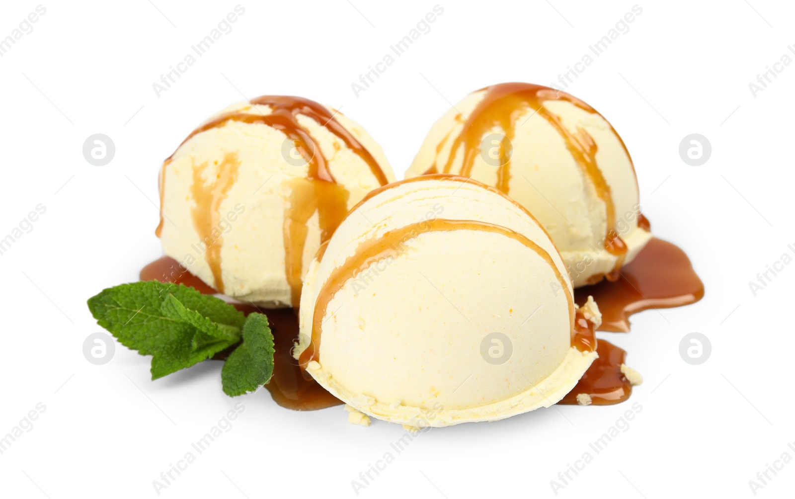 Photo of Delicious ice cream with caramel sauce and mint on white background