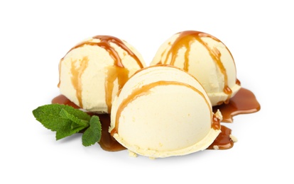 Delicious ice cream with caramel sauce and mint on white background