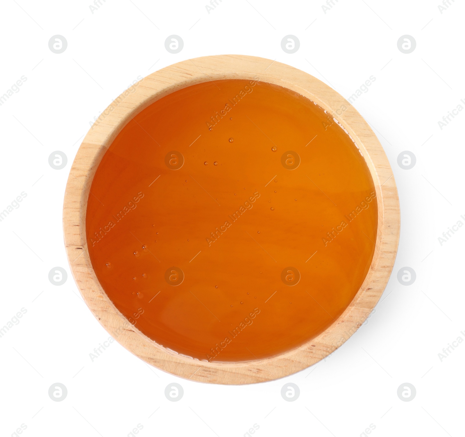 Photo of Tasty honey in bowl isolated on white, top view