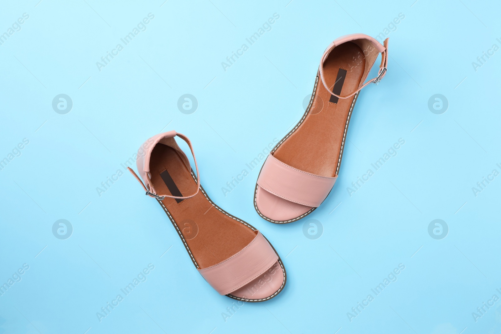 Photo of Pair of trendy women's shoes on color background, top view