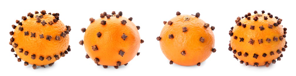 Image of Set with pomander balls made of tangerine and cloves on white background. Banner design