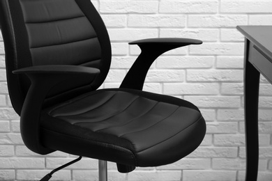 Modern office chair in stylish workplace interior