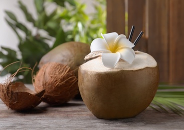 Fresh green coconut on wooden table