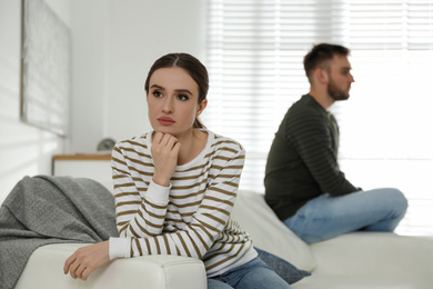 Young couple quarreling at home. Jealousy in relationship