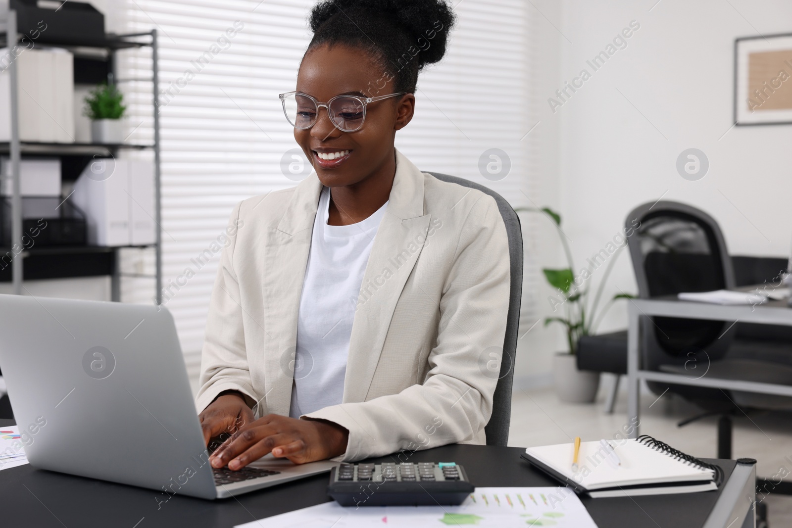 Photo of Professional accountant working on computer at desk in office