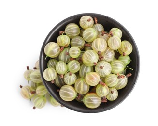 Bowl and ripe gooseberries on white background, top view