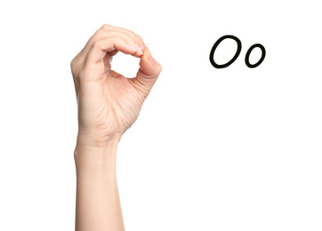 Image of Woman showing letter O on white background, closeup. Sign language