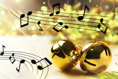 Music notes and jingle bells on blurred background, bokeh effect. Christmas and New Year melody