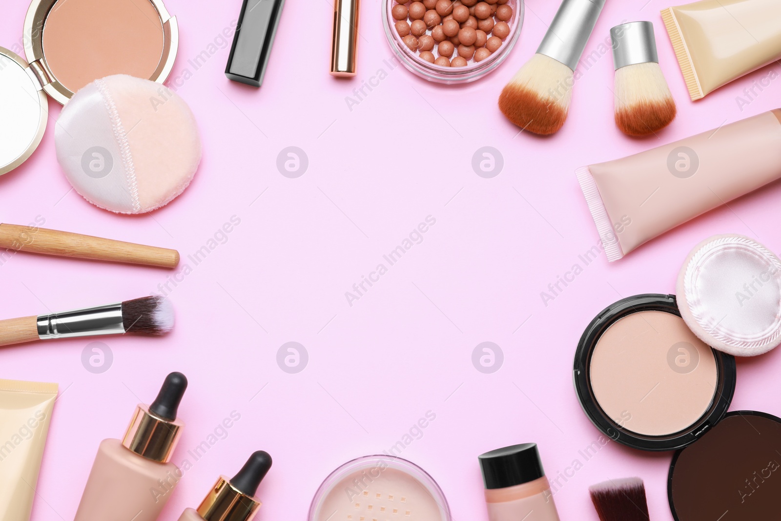 Photo of Face powders and other decorative cosmetic products on pink background, flat lay. Space for text