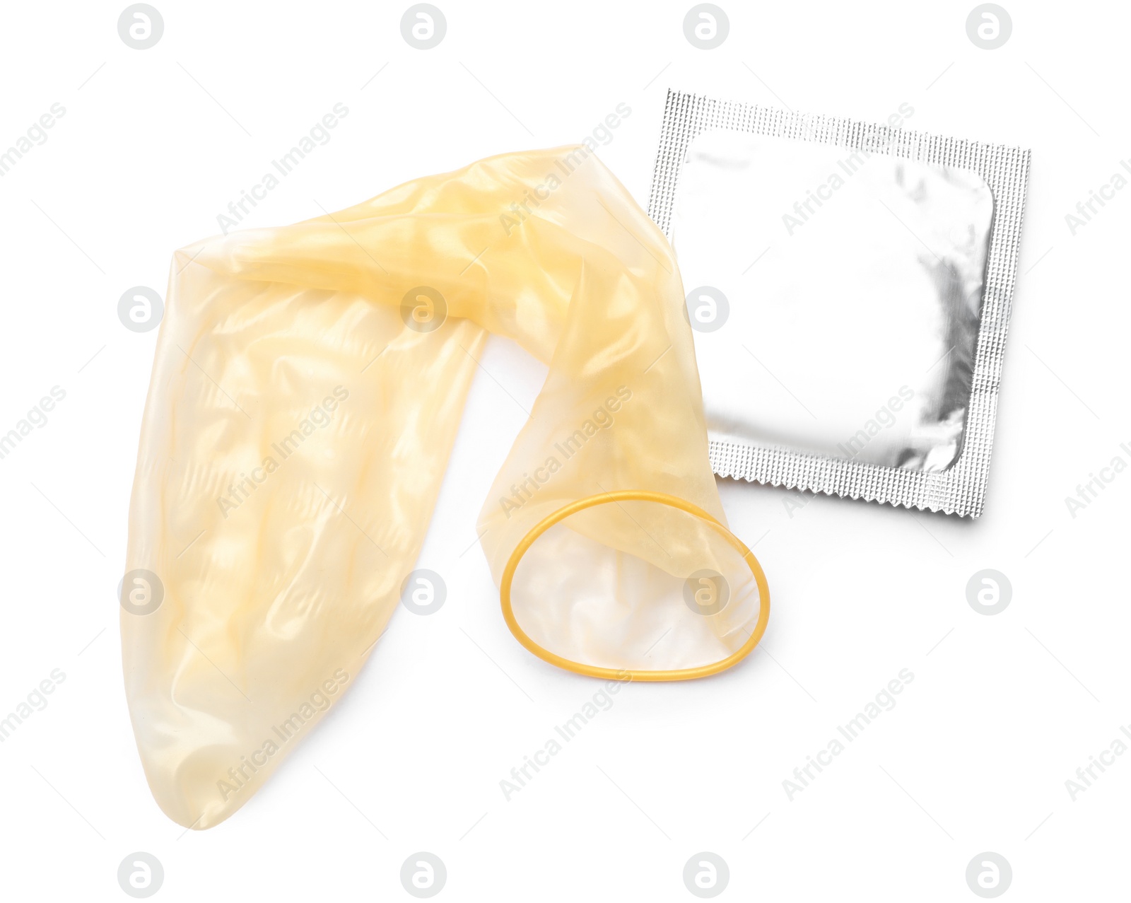 Image of Unrolled condom and package on white background, top view. Safe sex